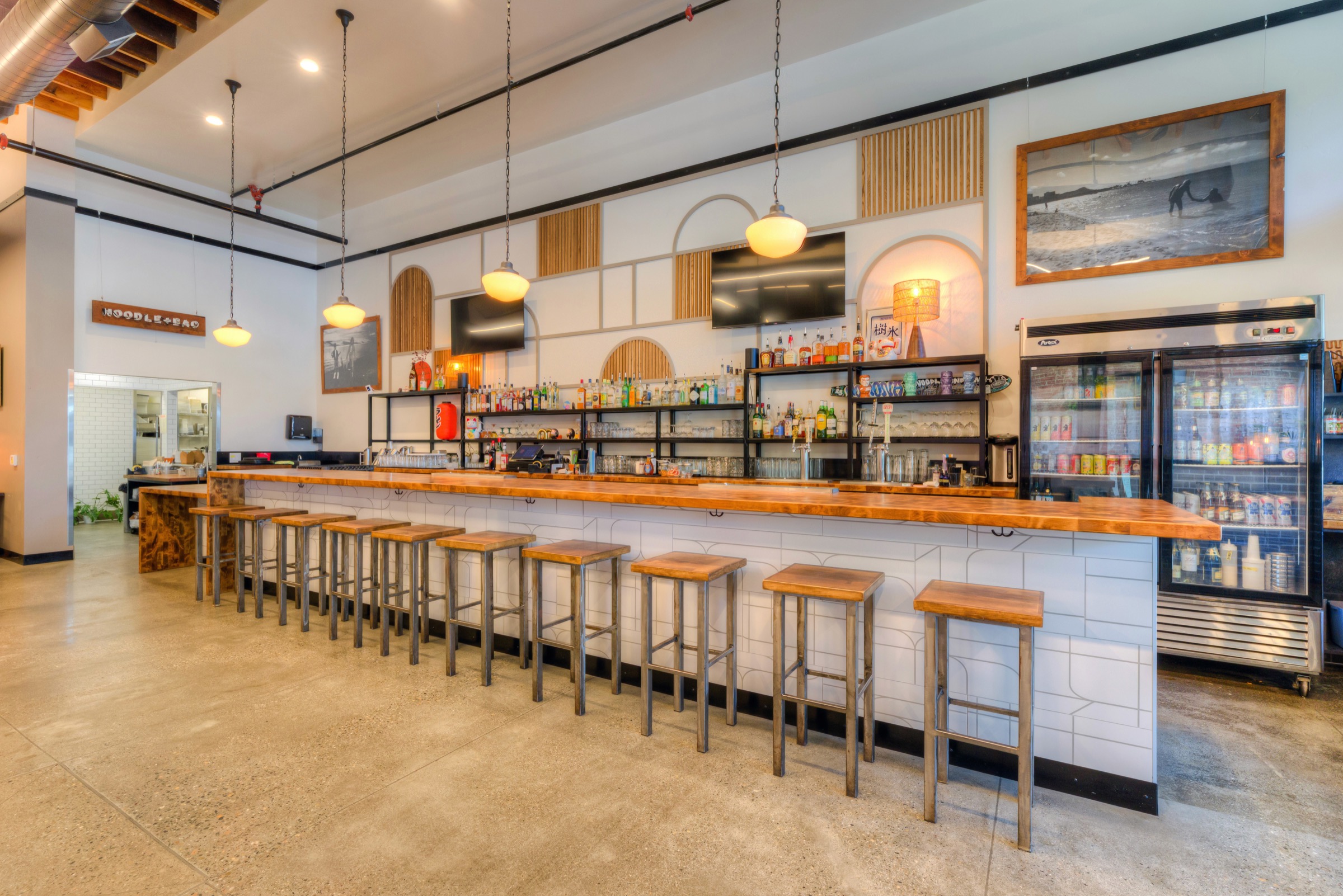 Modern bar with a long wooden top