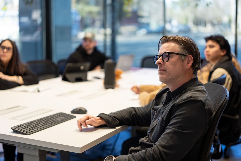 Nick Starnes seated at a conference table