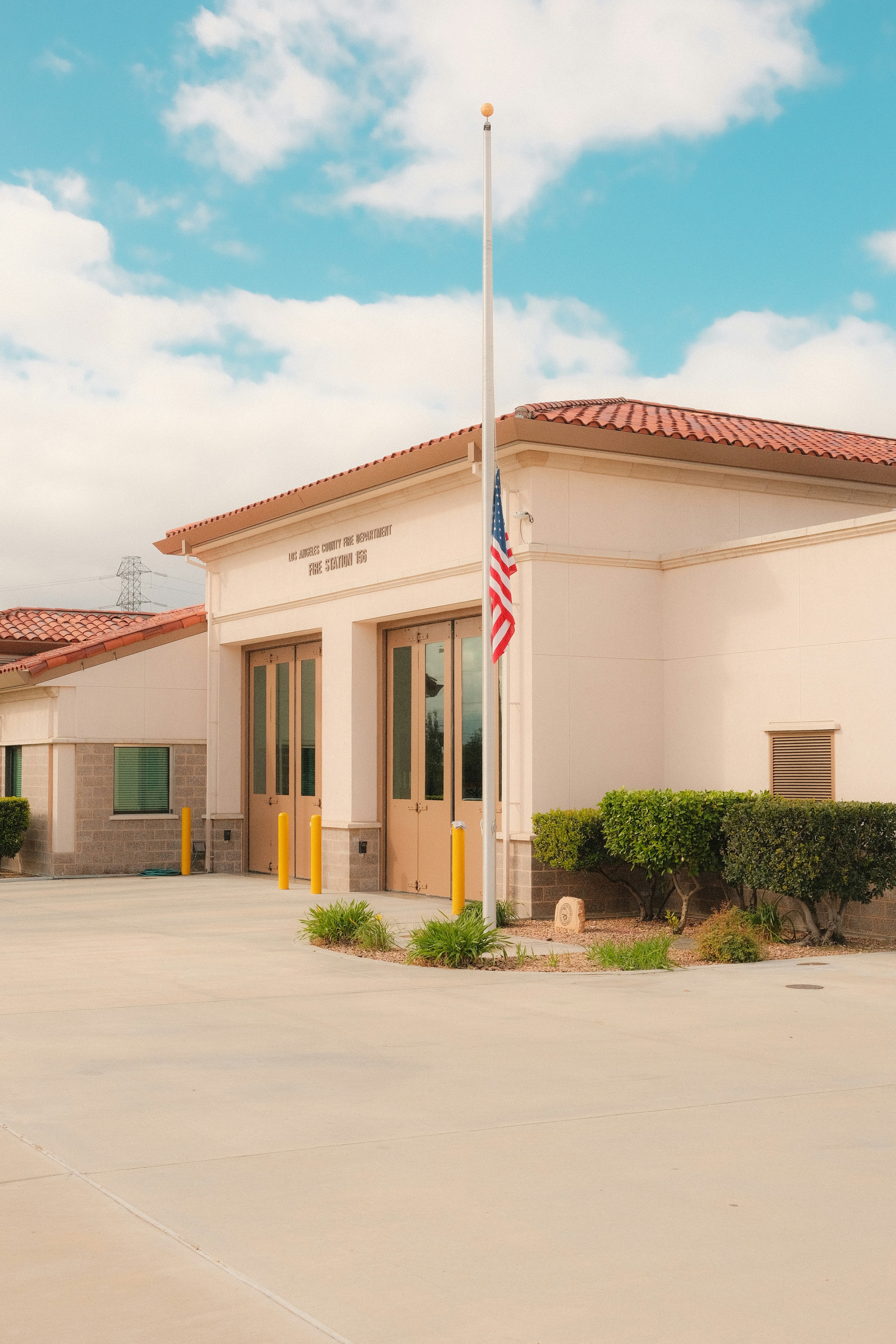 Fire station with an American flag at half-mast